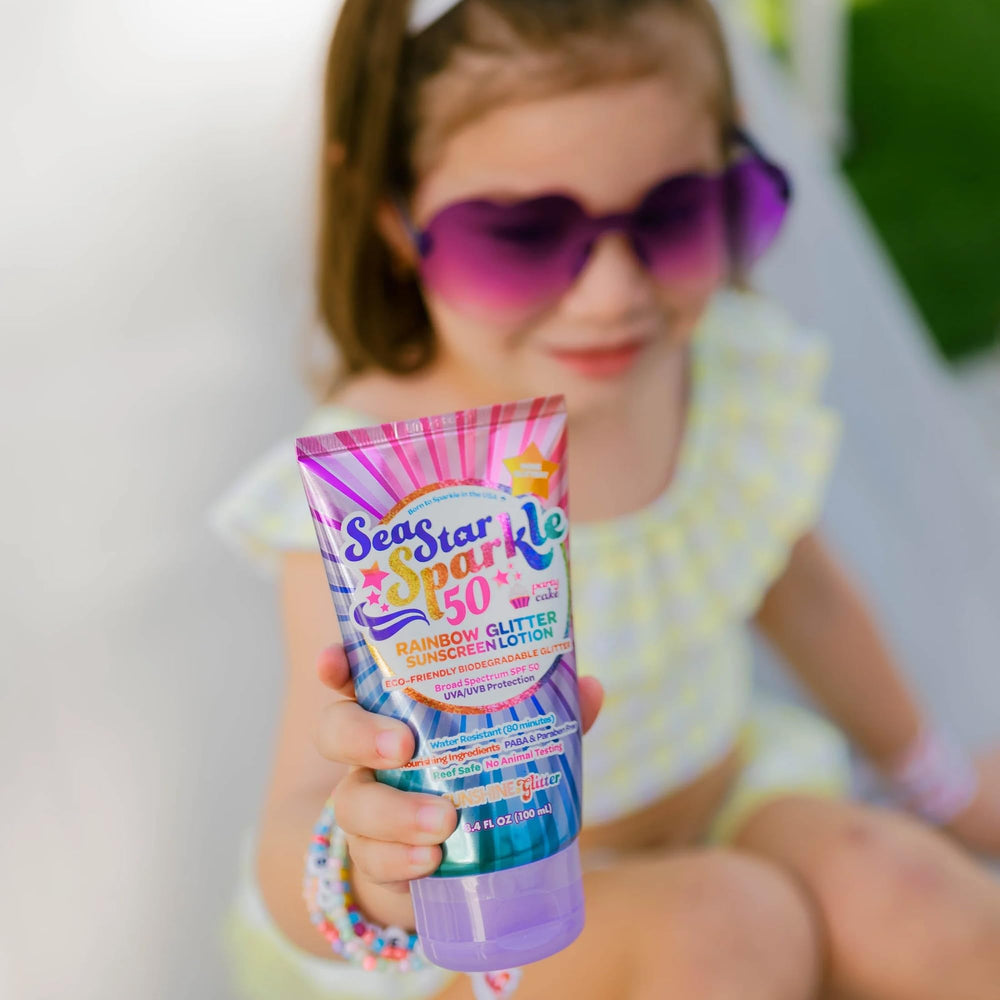 Sunshine and Glitter Seastar Sparkle kids-friendly application on small hands.
