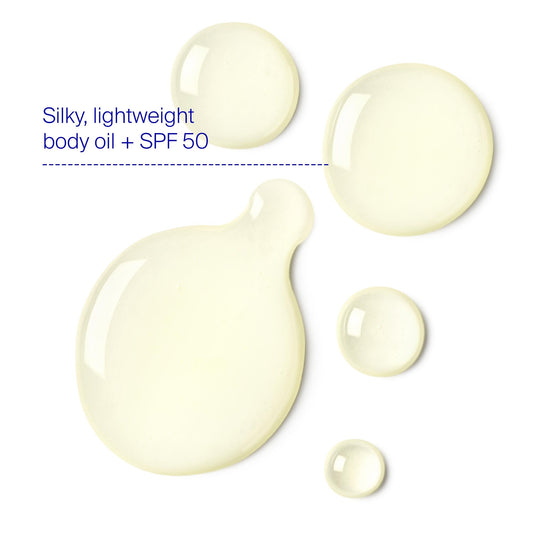 Supergoop Glow Oil applied to skin for lightweight SPF protection