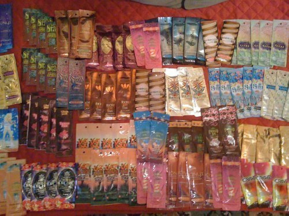 Supre indoor tanning lotion packets, assorted samples for easy trial and scent comparison.