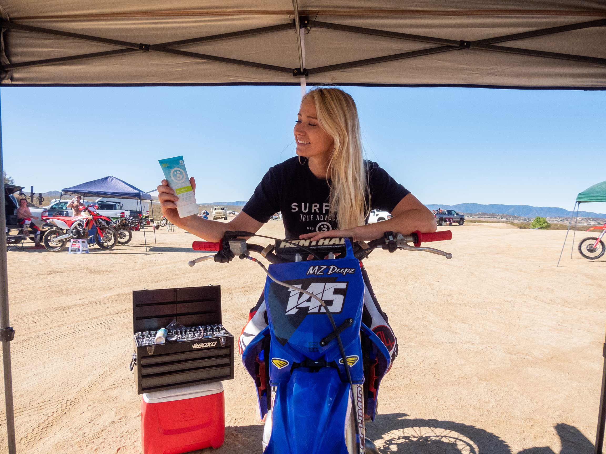 Surface Dry-Touch Lotion Sunscreen bottle demonstrates water resistance for active days