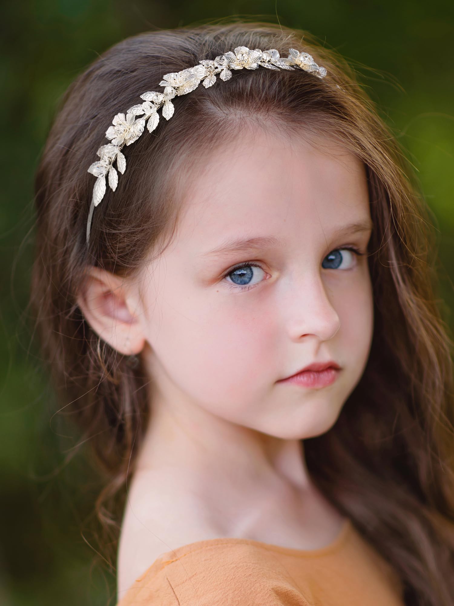 SWEETV flower girl headband in silver finishes a wedding-style look.