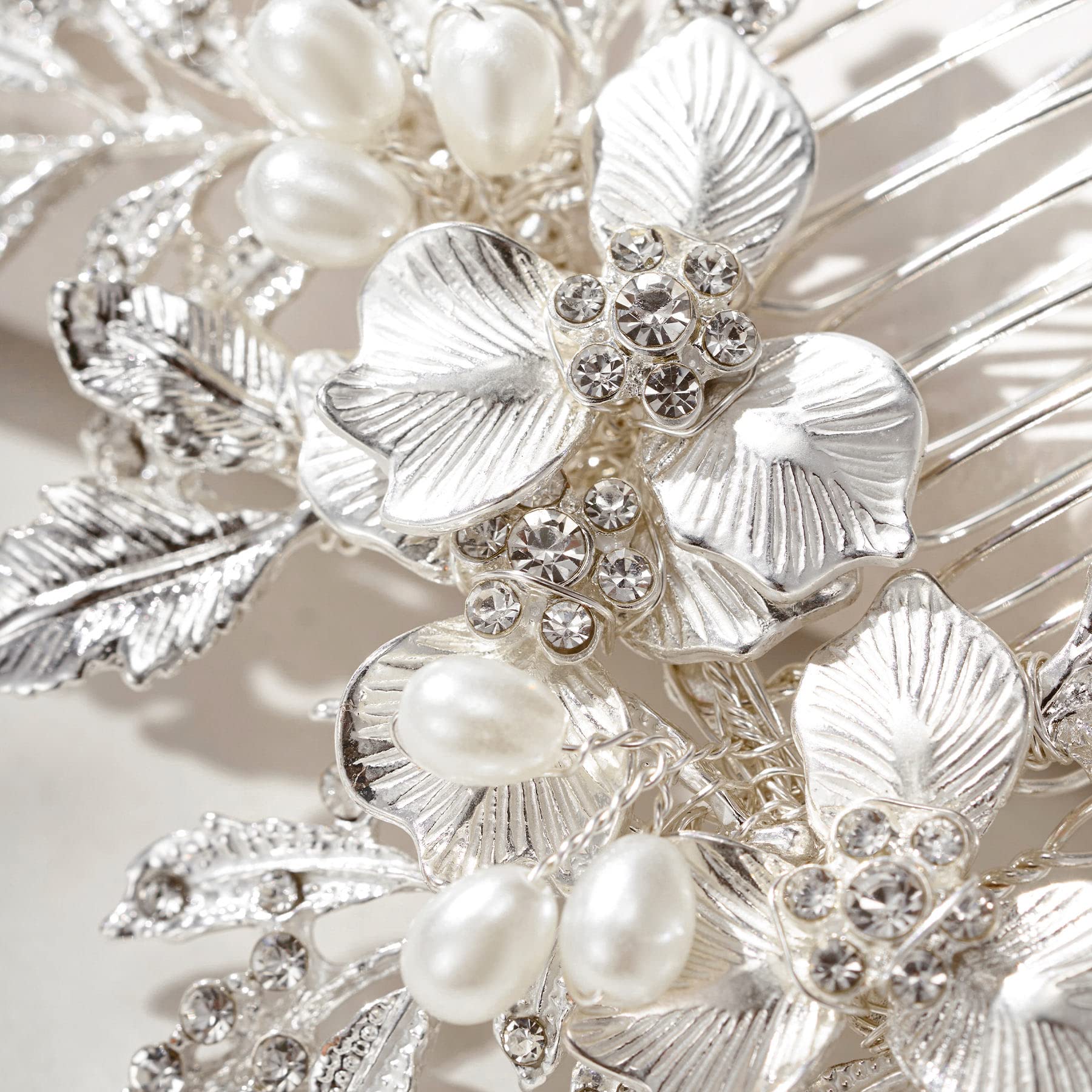 SweetV pearl and rhinestone flower design enhances wedding day silhouette.