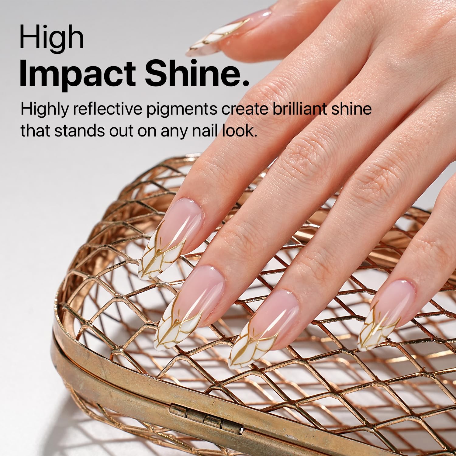 Gold shade used to create French tip design on nails.