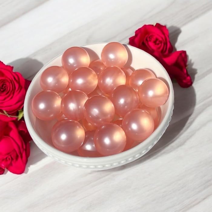 Bath beads swirling in water, creating a spa-like soak and silky skin feel.