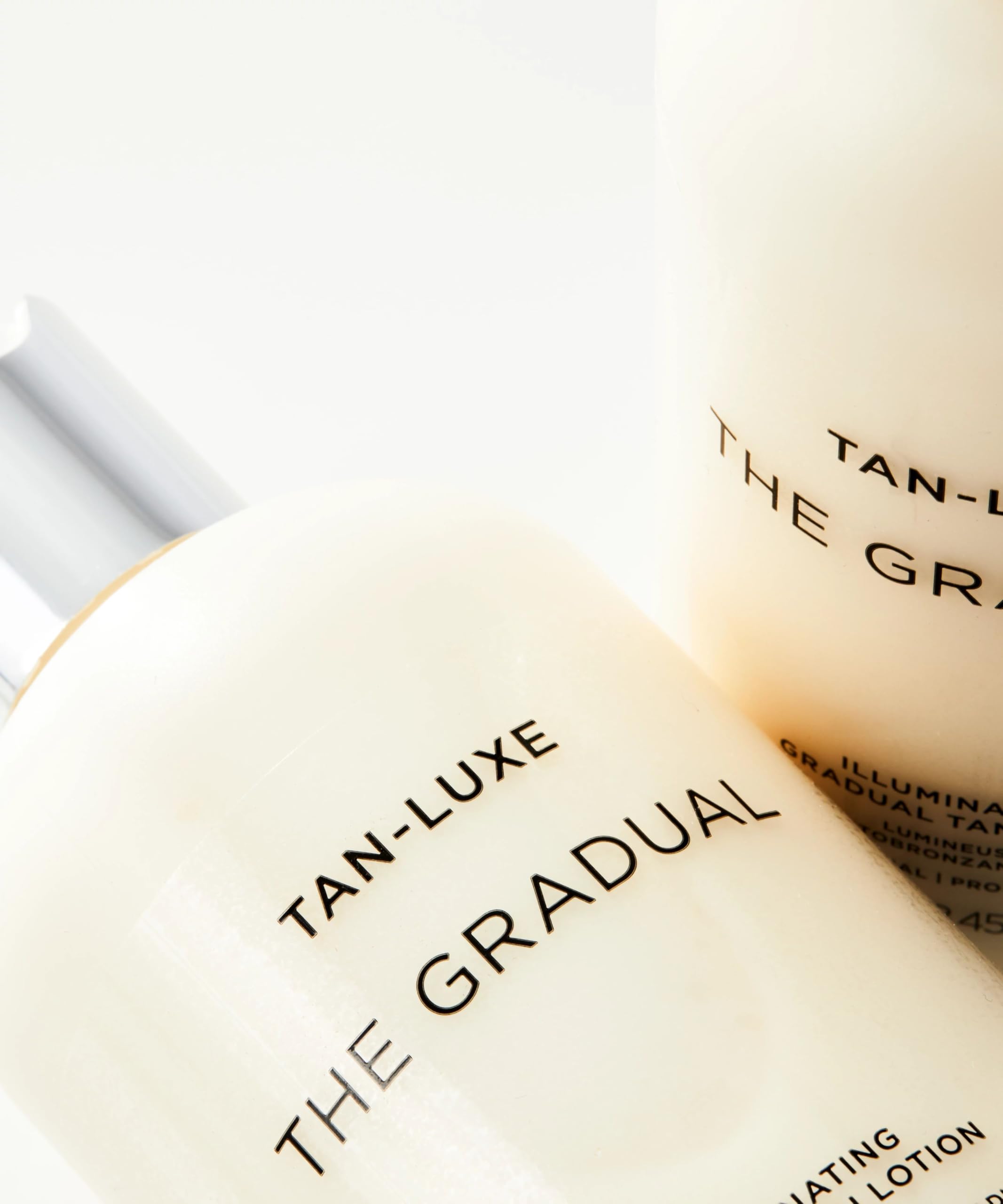 Tan-Luxe Gradual packaging close-up showcases sleek bottle and pump.