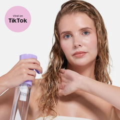 Tangle Teezer bottle shown beside a detangler brush for a smooth routine