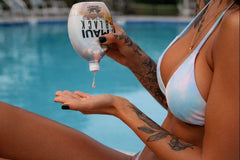 Tanning Paradise Maui Black lotion being applied on skin for rapid tan.