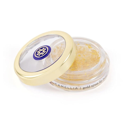 Tatcha Camellia Gold Spun Lip Balm tube; deeply hydrating, leaving lips soft.