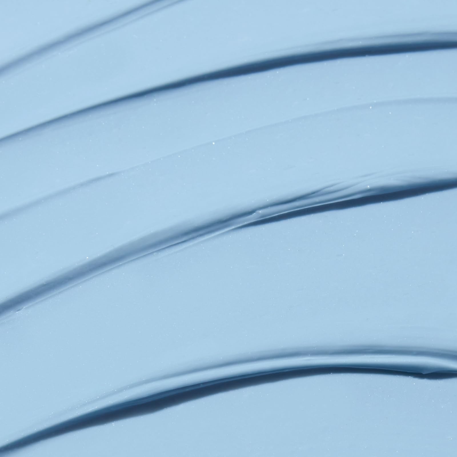 Close-up of Indigo Calming Cream texture showing creamy, soothing consistency.