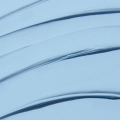 Close-up of Indigo Calming Cream texture showing creamy, soothing consistency.