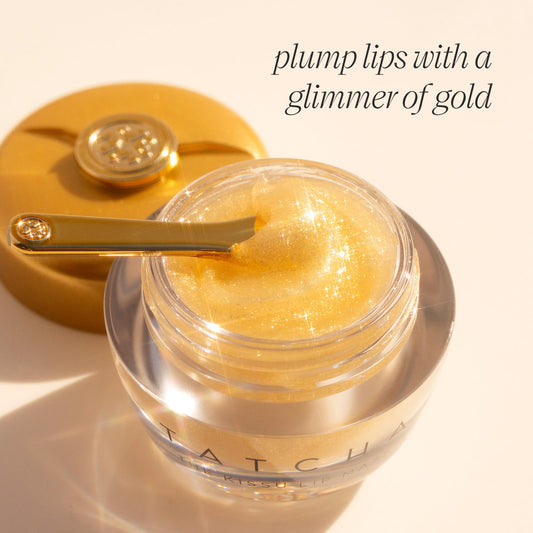 TATCHA Kissu Gold Leaf Lip Mask spread on lips delivering smooth, hydrated feel.
