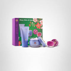 Tatcha Set display with berry lip gloss swatch.