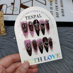 TENPAL nails with 3D cross, spider, and star charms for party-ready detail