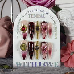 Close-up of Tenpal cat-eye embossed detail on long nails.