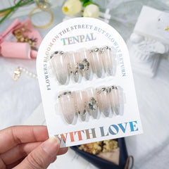 TENPAL long stiletto nails with nude glitter and cat-eye ombre for daily wear.