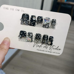 TENPAL Halloween party nails with skull accents for festive flair.