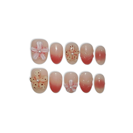 TENPAL handmade coral blush gradient nails with hand-sculpted flowers for vacation style.
