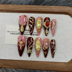 TENPAL handmade press-on nails in long stiletto shape with nude pink wine cross design.
