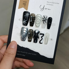 TENPAL long coffin nails with gothic embossed sun detail for eye-catching appeal