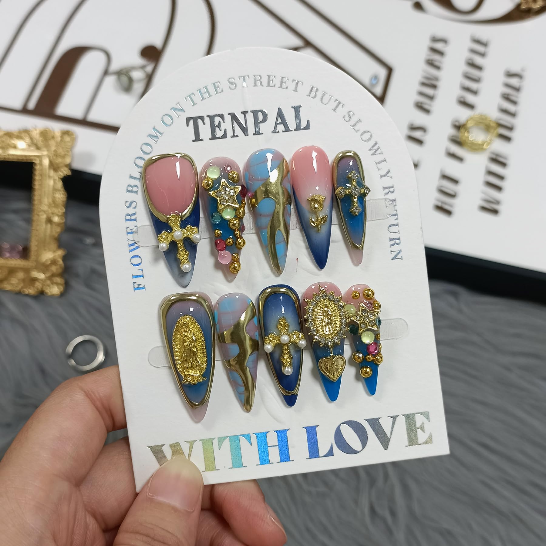TENPAL long stiletto nails with glossy metallic cross embellishment