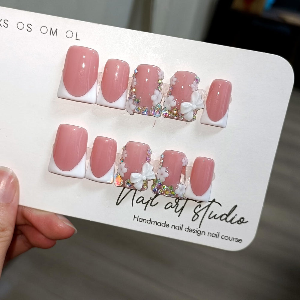 TENPAL nails with rhinestones and a 3D bow add sparkle for special occasions