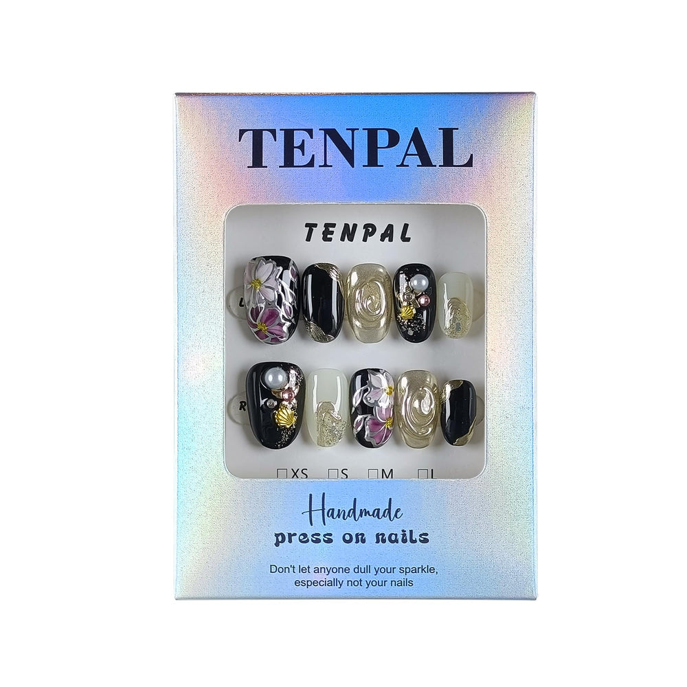TENPAL closeup-sparkle nails show intricate hand-painted details.
