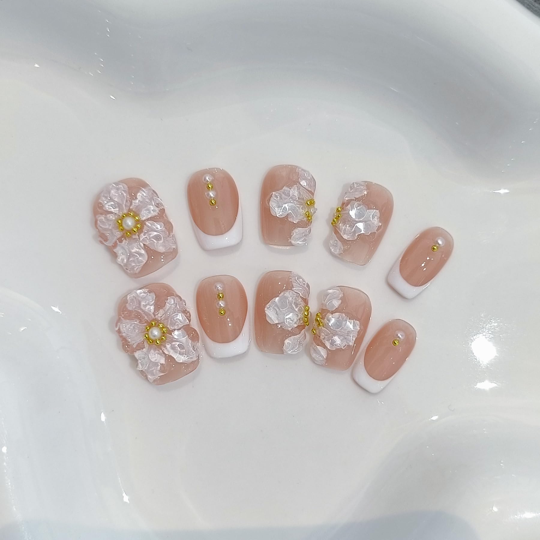 TENPAL nude French embossed nails offer subtle elegance.