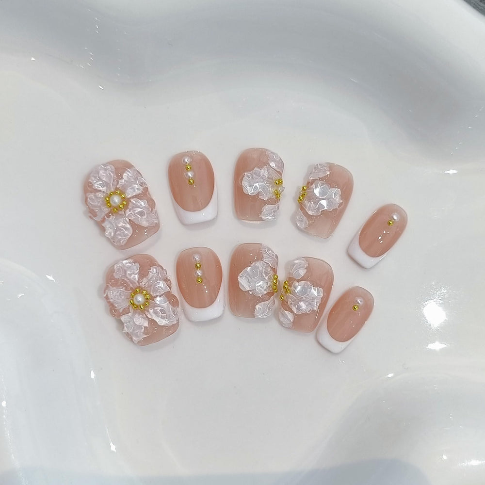 TENPAL nude French embossed nails offer subtle elegance.