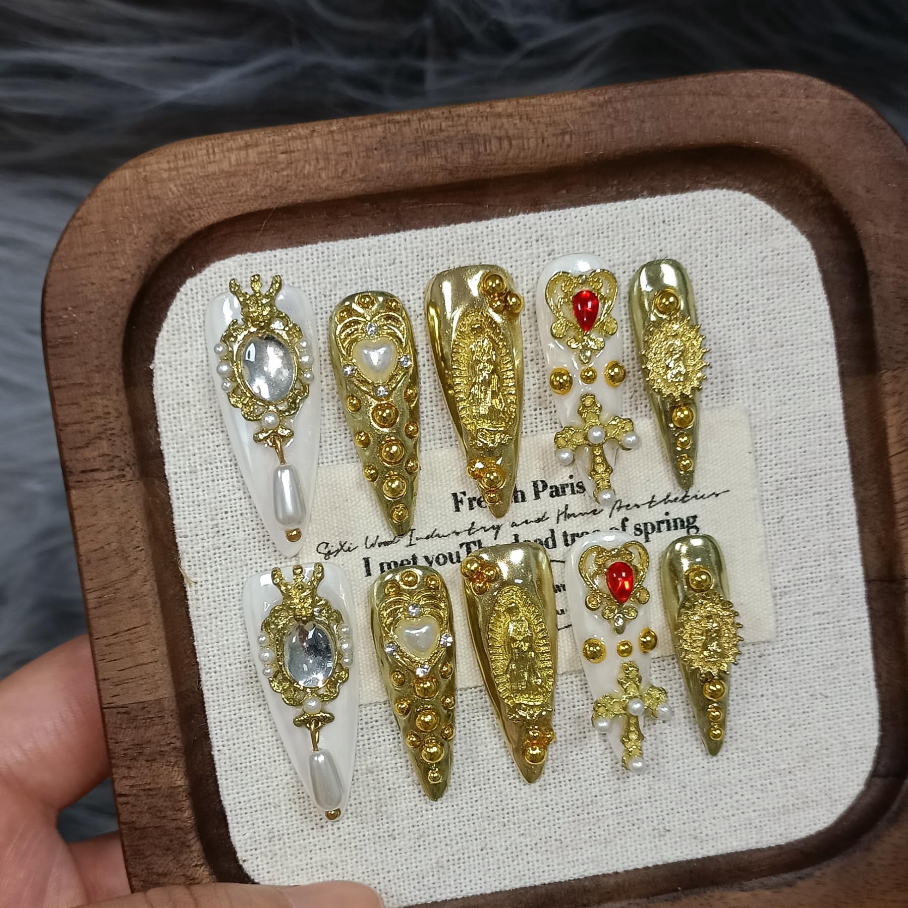 TENPAL royal press-on nails in metallic gold stiletto with pearls for a luxe look.