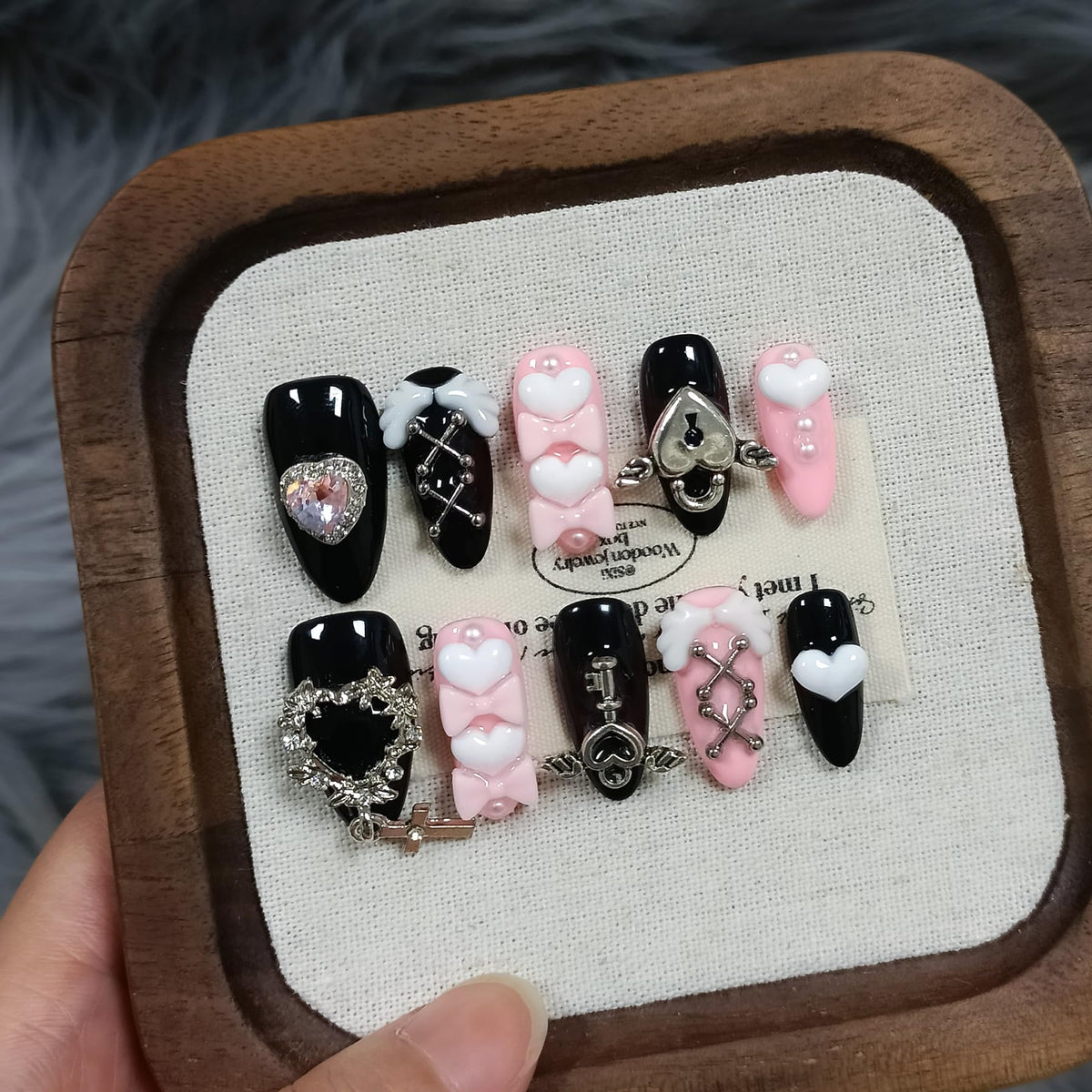TENPAL Y2K press-on nails in ebony and pink almond with a glossy finish