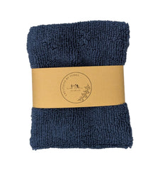 Terry cloth soap holder in dark blue, ideal for hanging and quick drying.