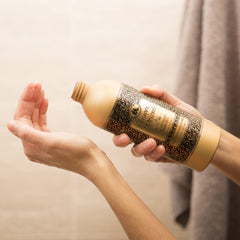 Pour shot reveals creamy texture enriched with sesame oil for nourishing feel.