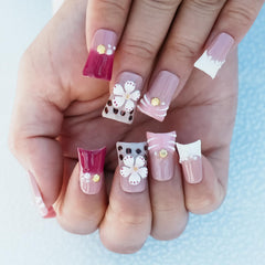 Tesytto nails showing 3D floral leopard print for statement style.