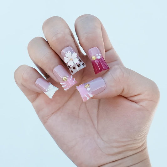 Tesytto French-tip nails in white and pink with glossy finish.