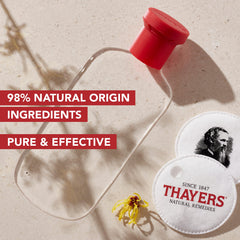 Rose petals imagery on THAYERS toner conveying a refreshing experience