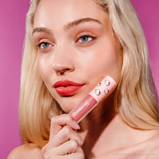 Hello Kitty lip oil applicator wand in mauve tone for smooth lips.