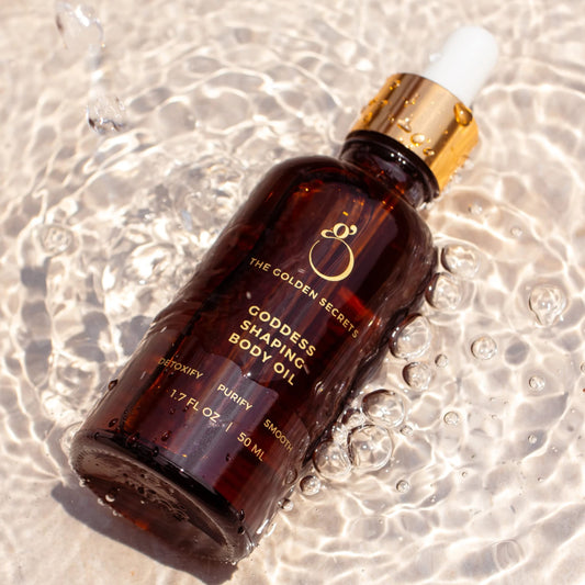 The Golden Secrets Goddess Shaping Oil application demonstrates smooth texture for daily massage