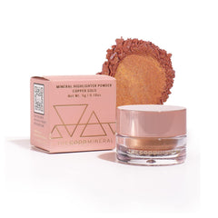 The Good Mineral Copper Gold highlighter in compact for a sun-kissed glow.