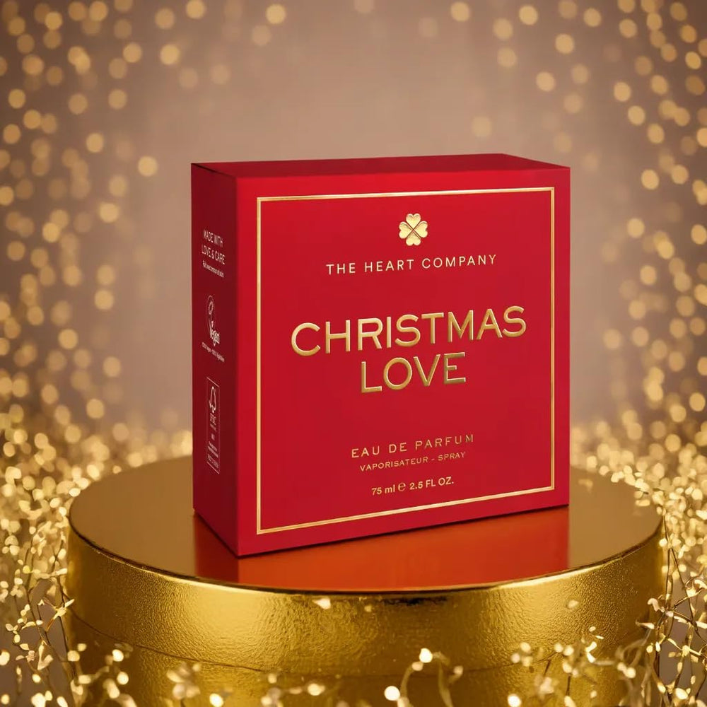 The Heart Company Christmas Love ornamental cap accents a romantic scent.