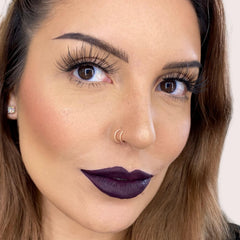 The Lip Bar Drama Queen lip color applied for a dramatic evening look.