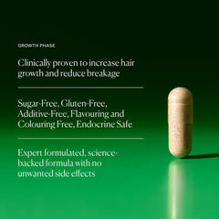 Close-up of Growth Phase capsules indicating vegan hair health support