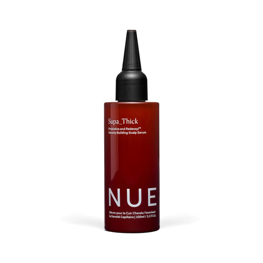 The Nue Co Supa Thick Hair Serum bottle close-up for a lightweight, refreshing scalp treatment.