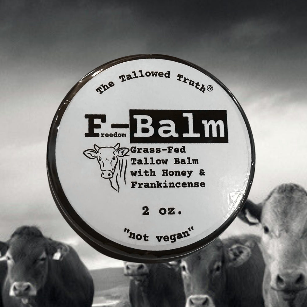 Two-ounce The Tallowed Truth balm beside skincare tools
