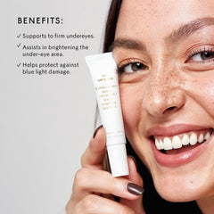 The Untamed Superluminal Dawn Eye Serum being applied around the under-eye area for hydration.