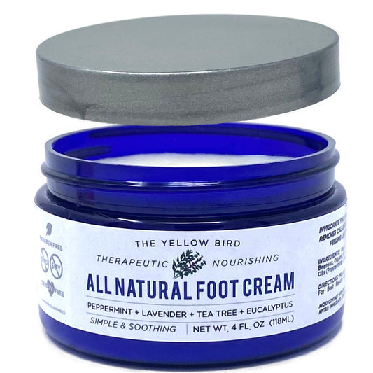 The Yellow Bird tea tree foot cream bottle pump for easy, deep moisture.