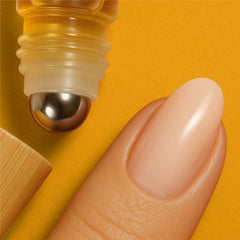Theniya cuticle oil bottle with bamboo cap design.