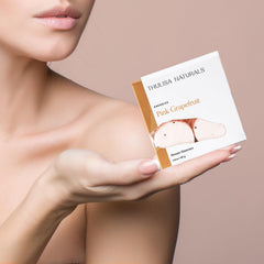 Thulisa Naturals pink grapefruit steamers on a bathroom shelf for gifting.