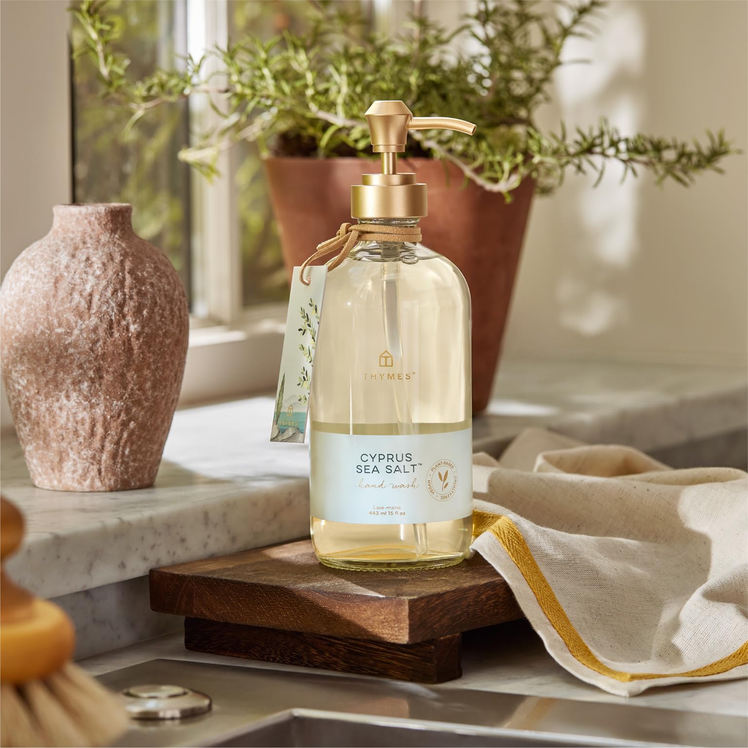 Thymes Cyprus Sea Salt foamy lather releasing fresh notes during washing.