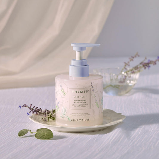Thymes Replenishing Hand Lotion pump on a clean surface for instant hydration.