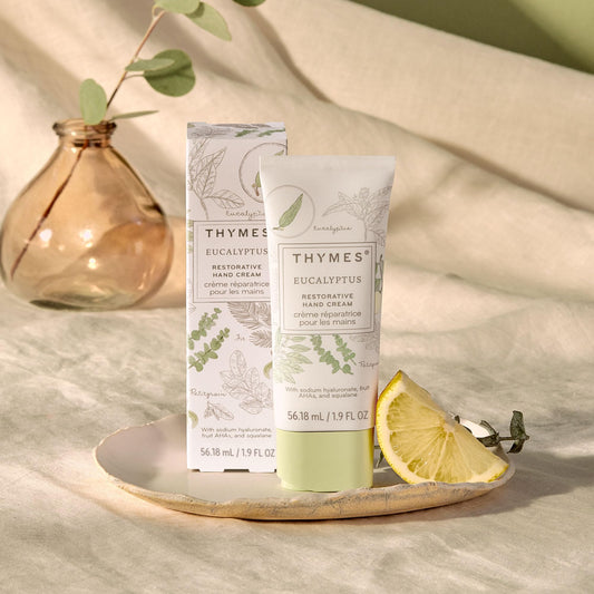 Close-up of Thymes Restorative Hand Cream label showing fragrance and vegan formula